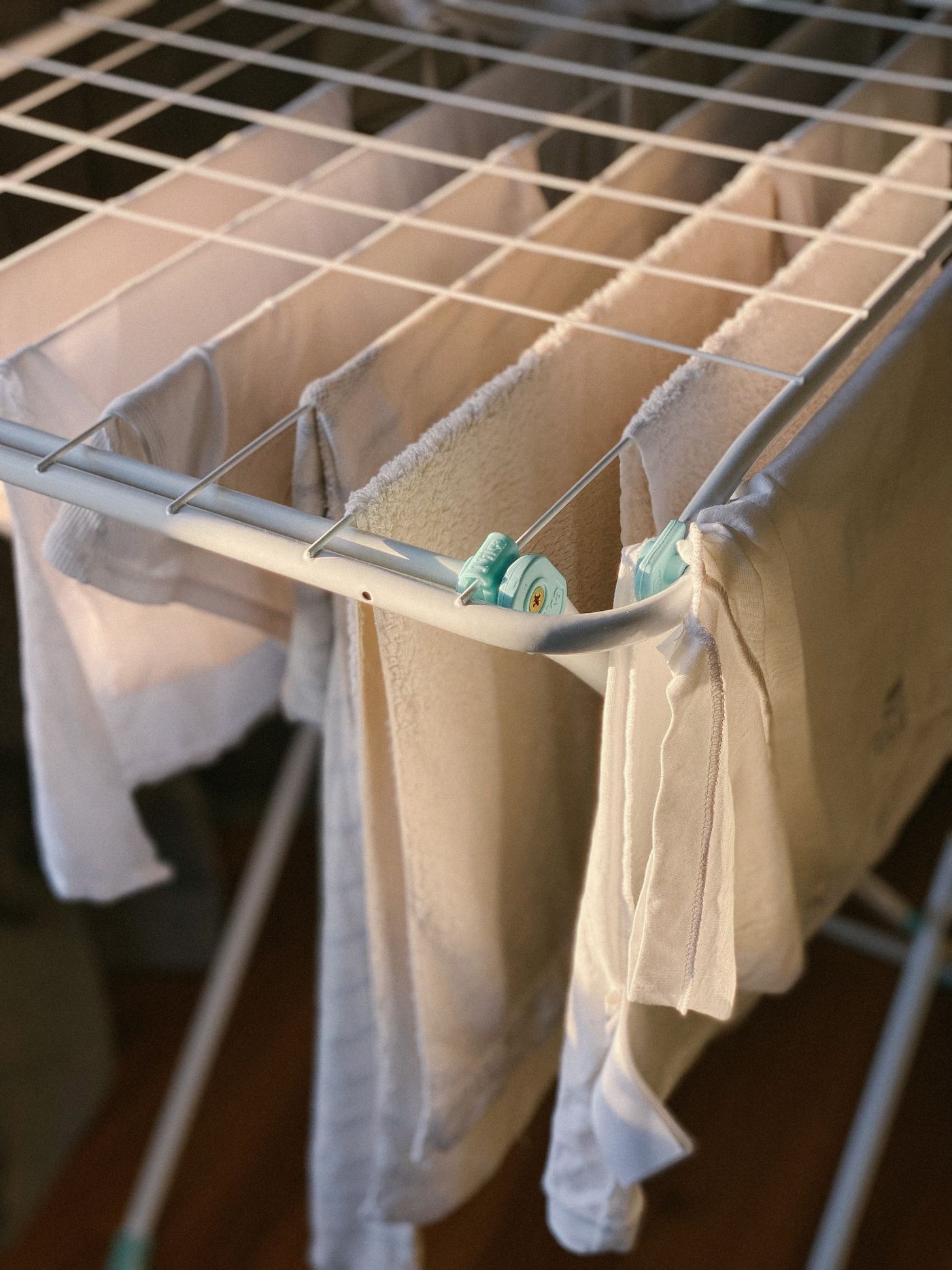 White laundry on an indoor drying rack