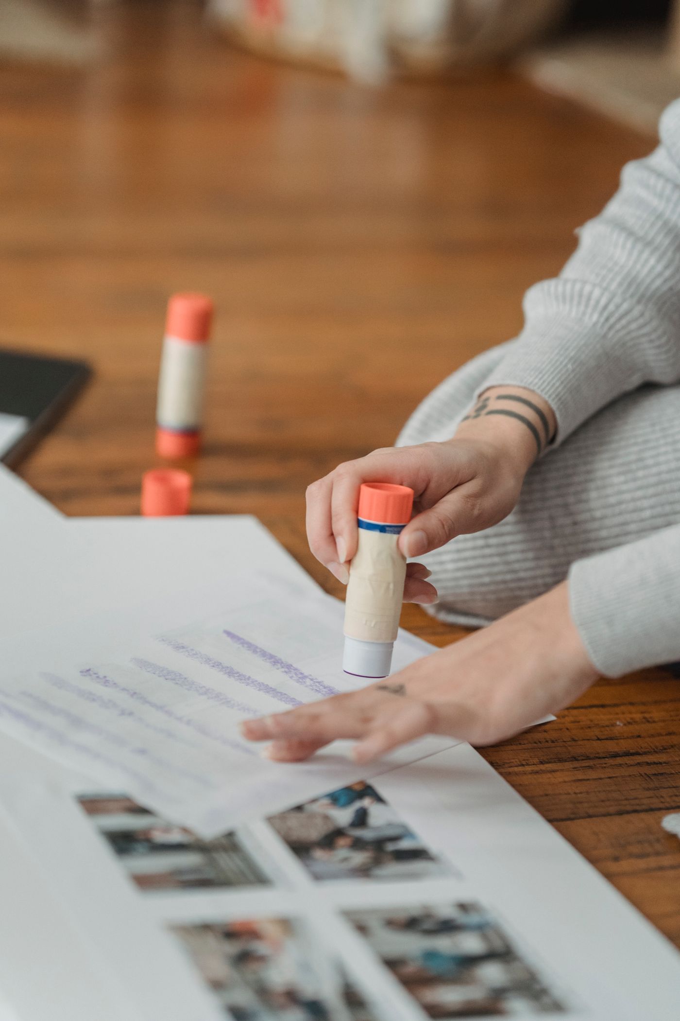 A person gluing papers for a collage