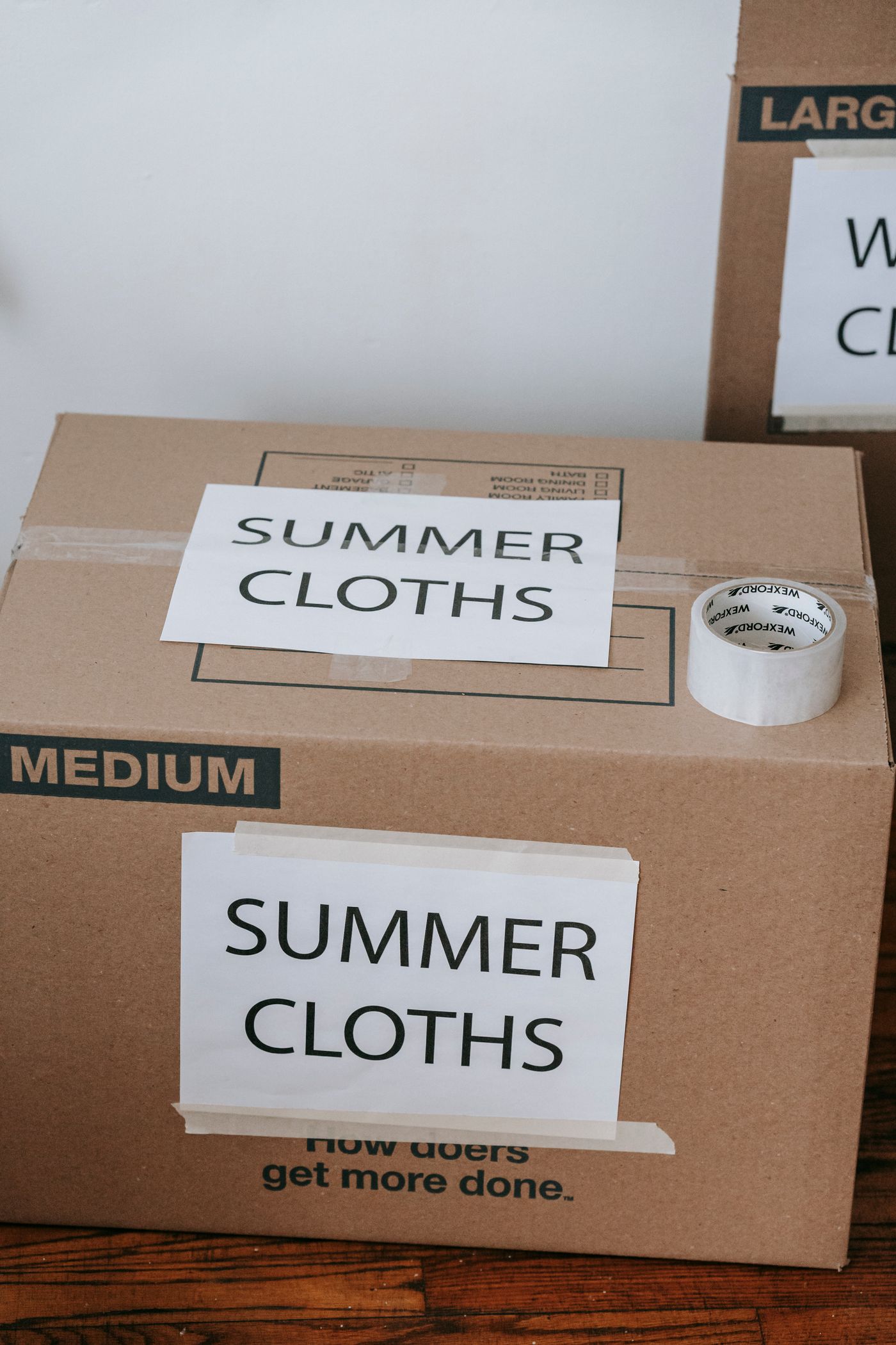 Labelled boxes for storing summer clothes