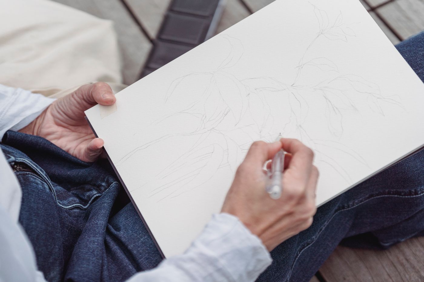 A hand drawing in a sketchbook outdoors