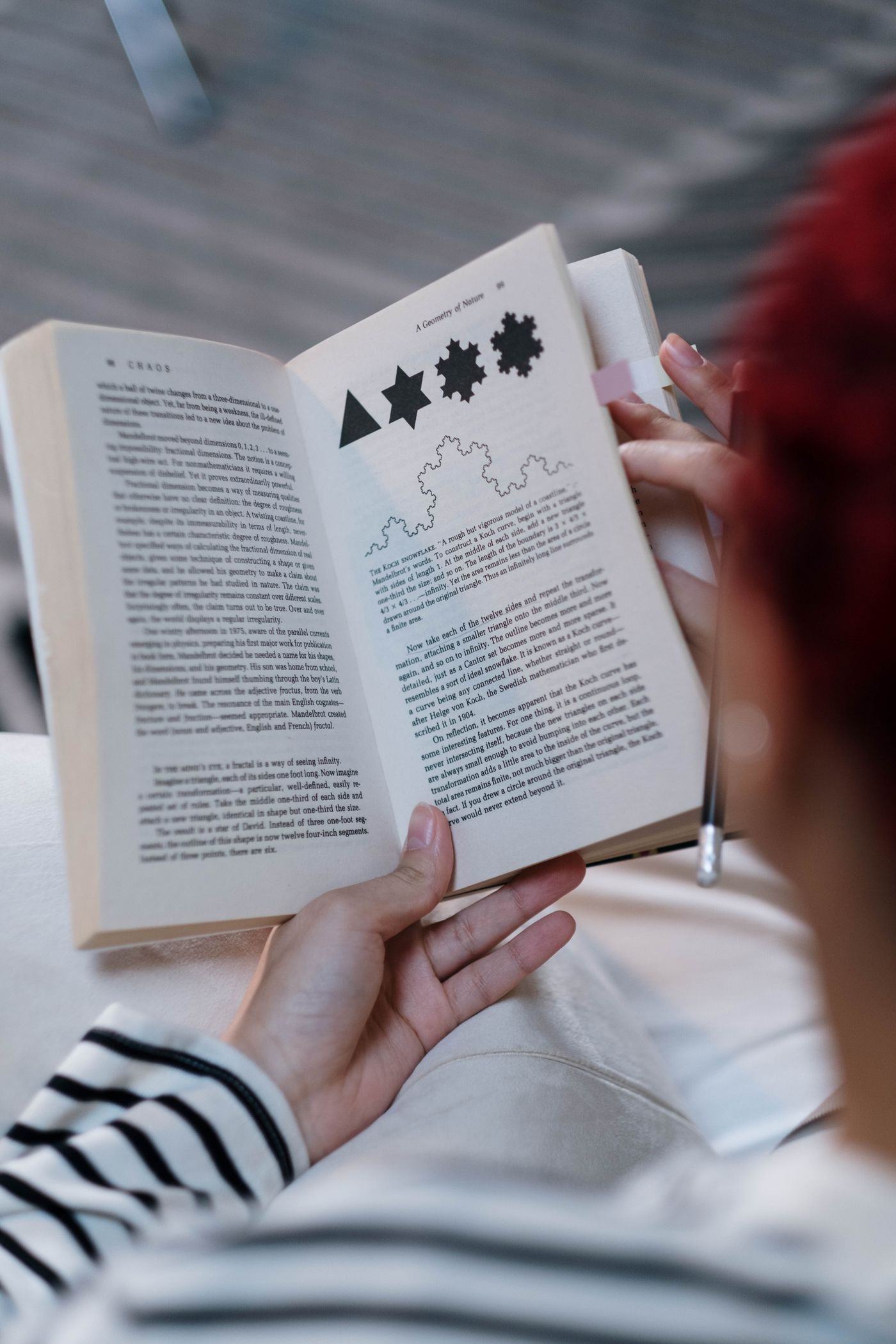 A person reading an open book