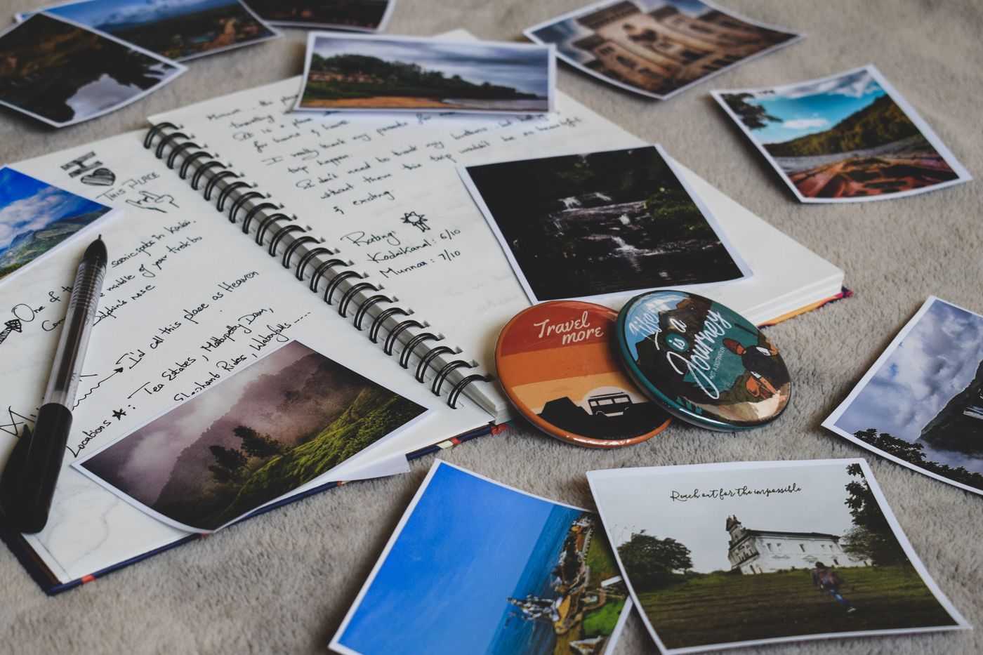 Photographs and a notebook gathered on a table
