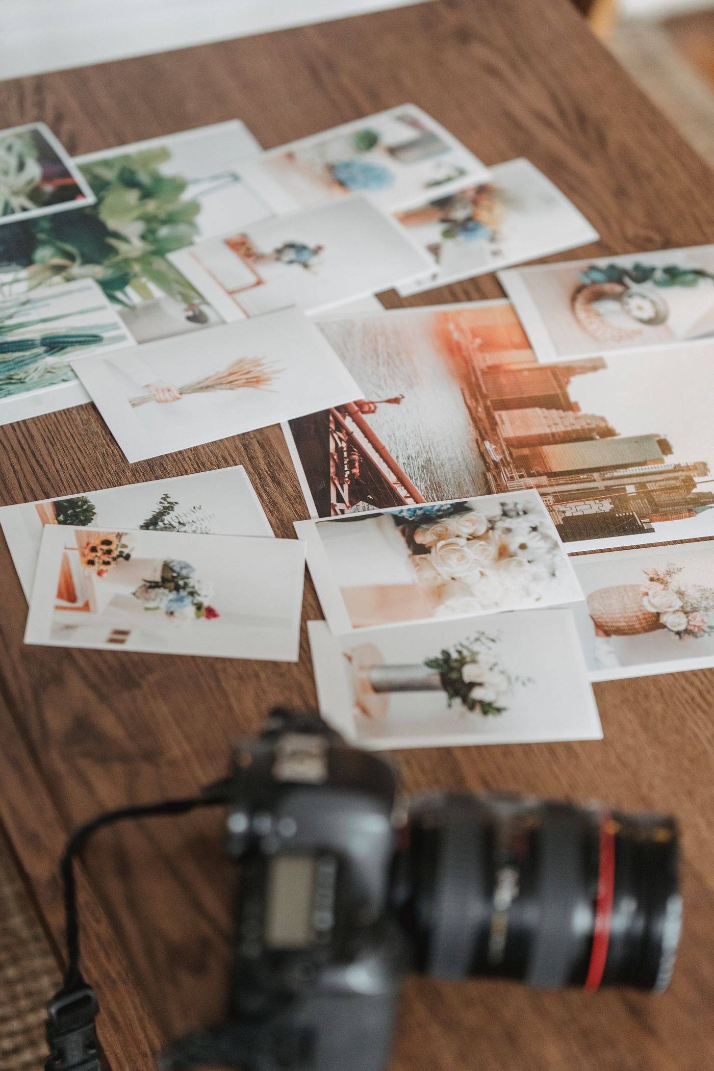 Printed photographs spread over a table